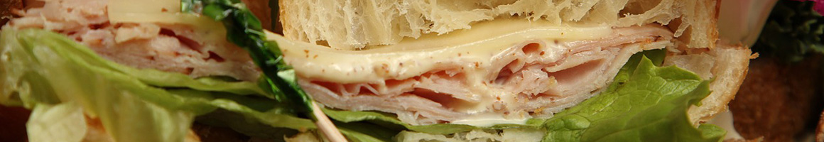 Eating Deli Sandwich at DiBella's Subs restaurant in Solon, OH.